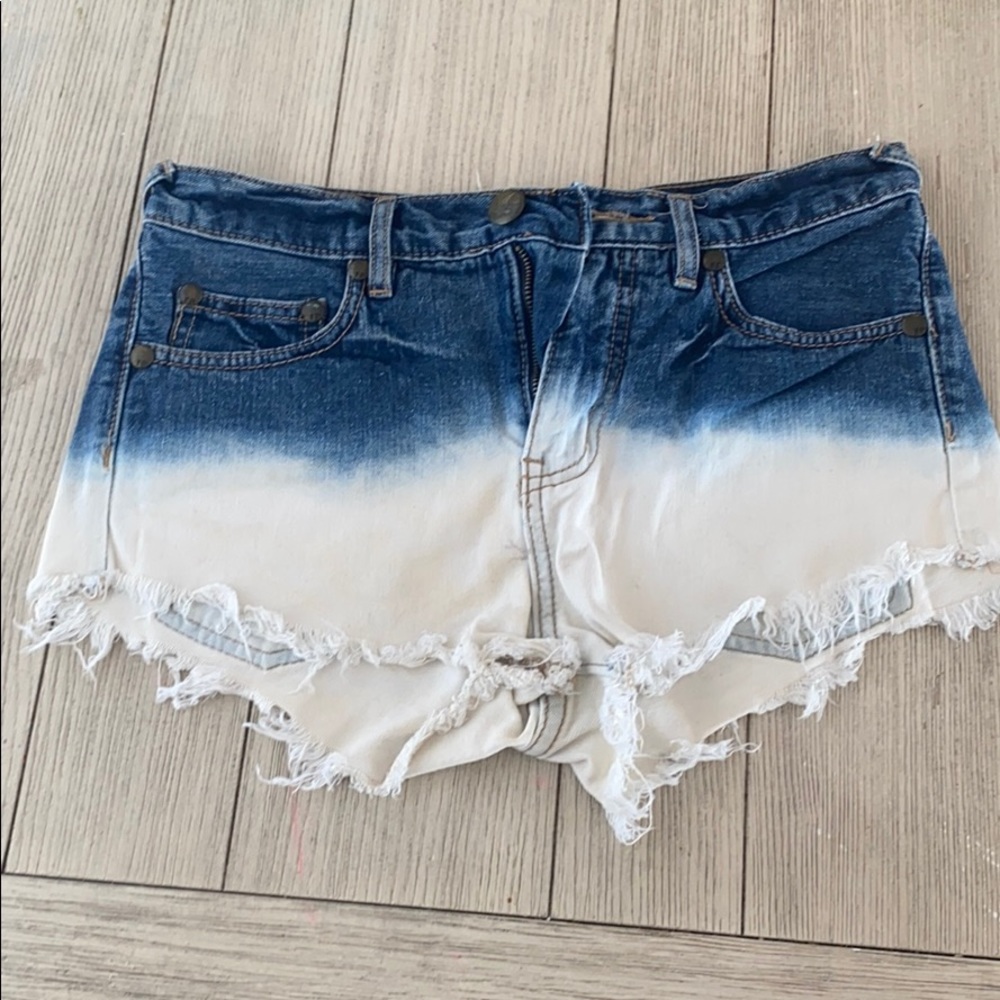 Free people tie dye dipped Jean shorts.
